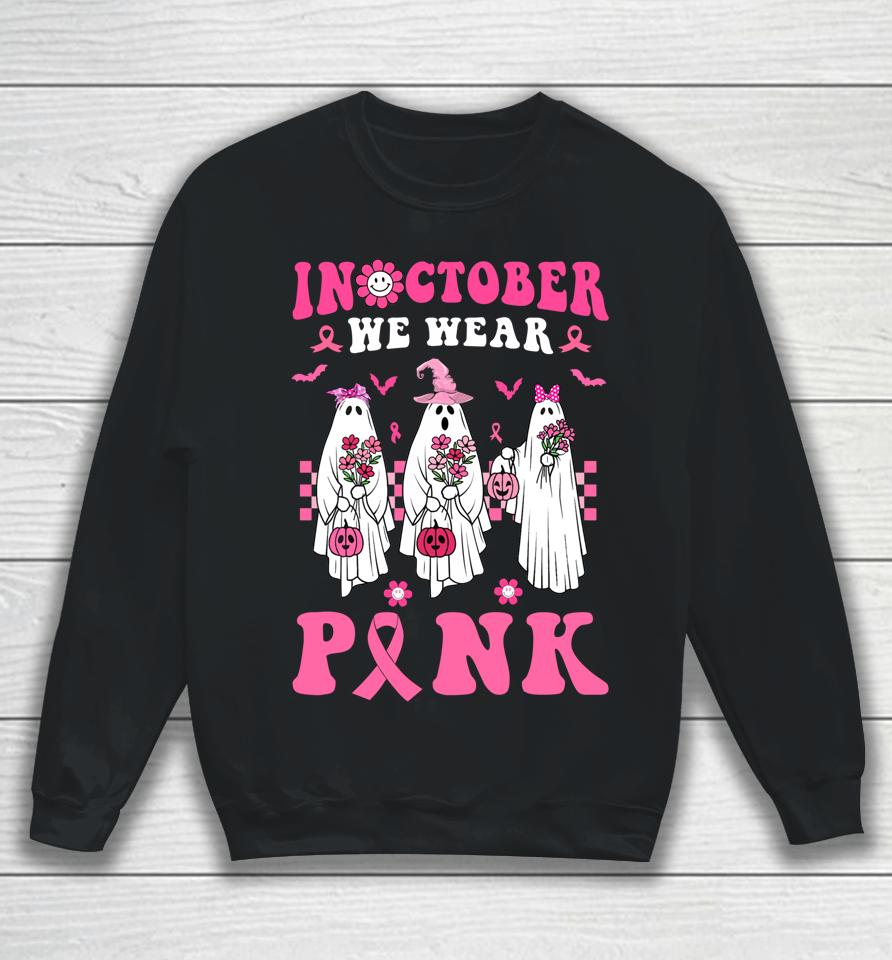 Groovy We Wear Pink Breast Cancer Floral Ghost Halloween Sweatshirt