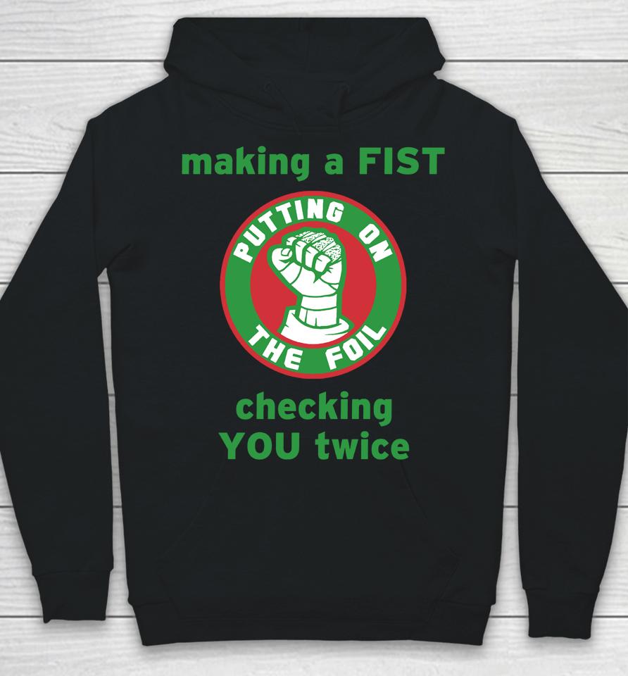 Making A Fist Putting On The Foil Hoodie