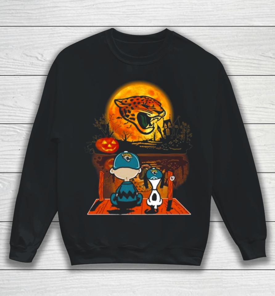 Snoopy And Charlie Brown Jacksonville Jaguars Sitting Under Moon Halloween 2023 Sweatshirt